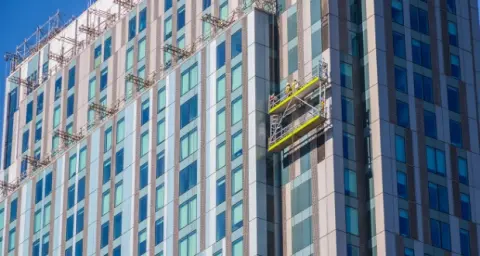 Window cleaner lift on the side of a new high-rise building