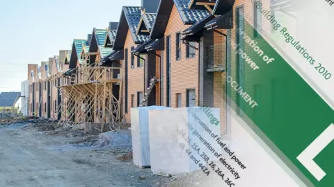 Houses in construction with Part L Building Regulations Approved Document L overlaid.